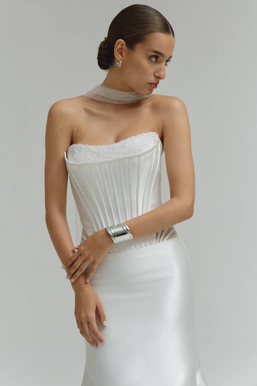 Detail shot of a pearl corset bodice