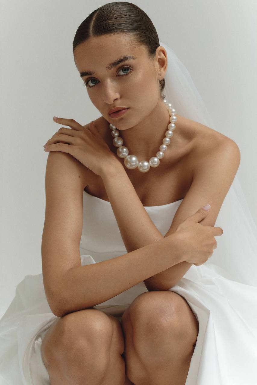 Bridal lookbook portrait with a pearl necklace, Oui The Label