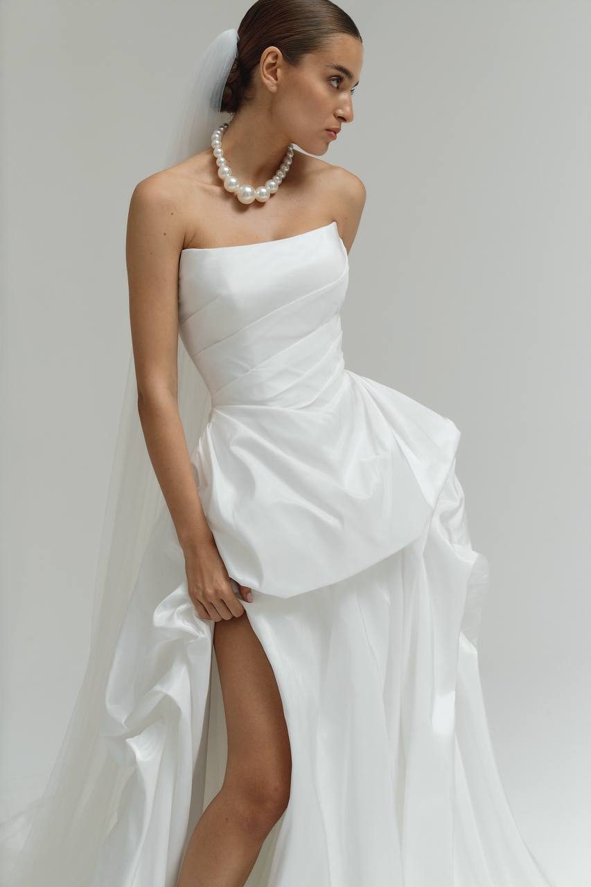 Bridal lookbook look in a draped gown with pearls