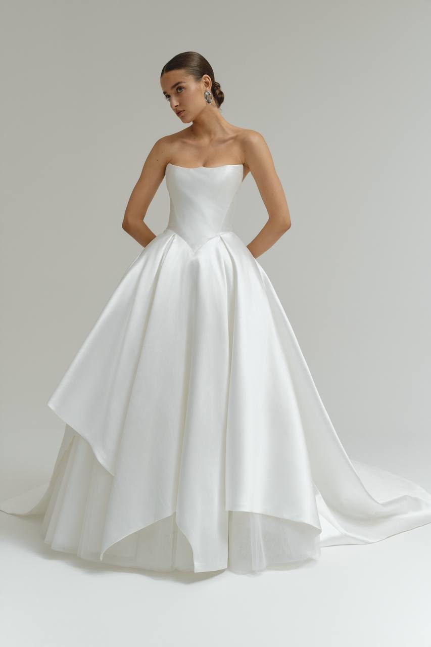 On-model e-commerce image of a satin ball gown, front view