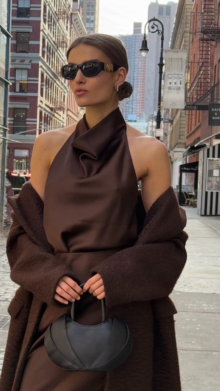 Chocolate satin halter and coat in low winter sun
