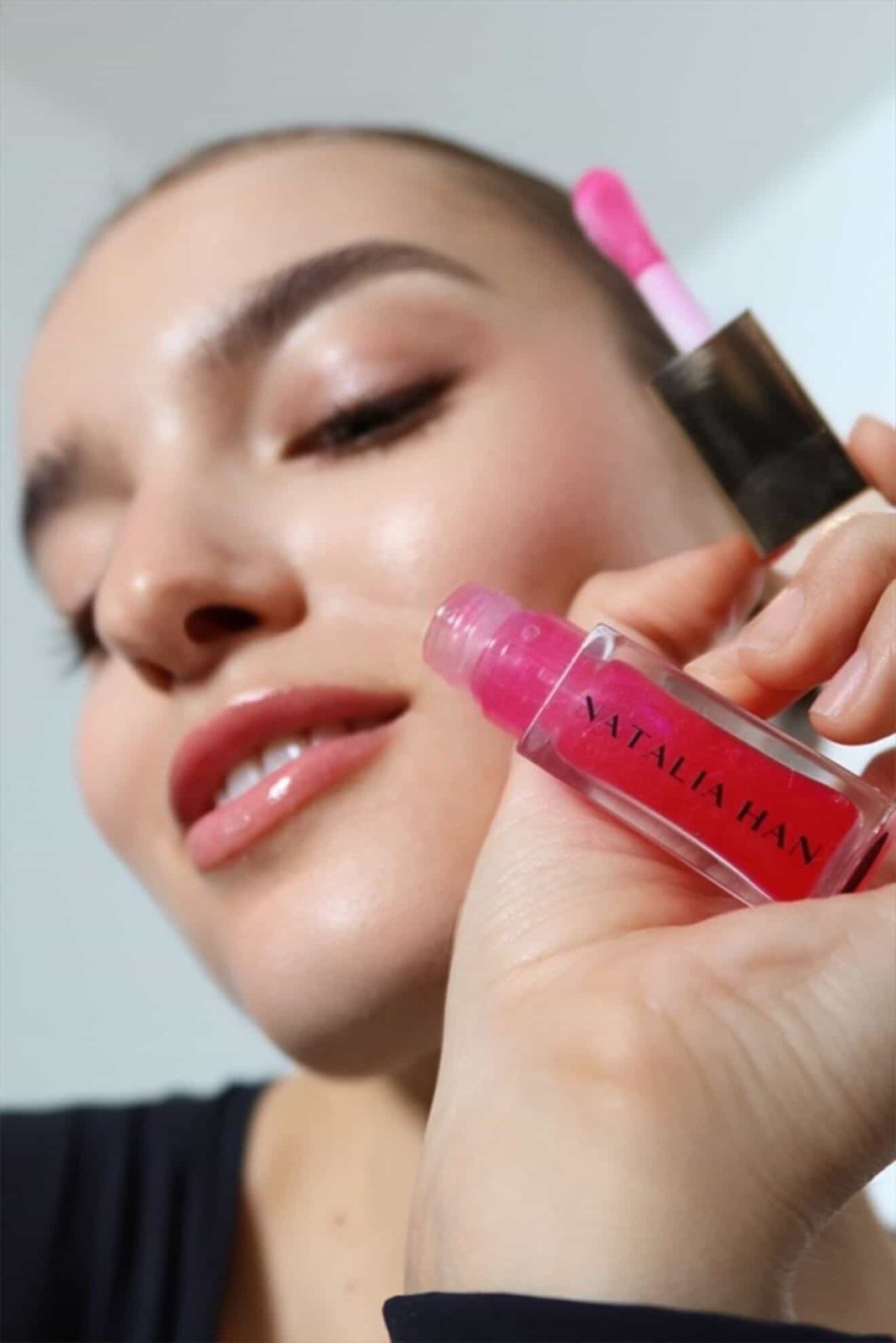 Natalia Han Beauty lip oil close to glossy lips in a studio beauty shot