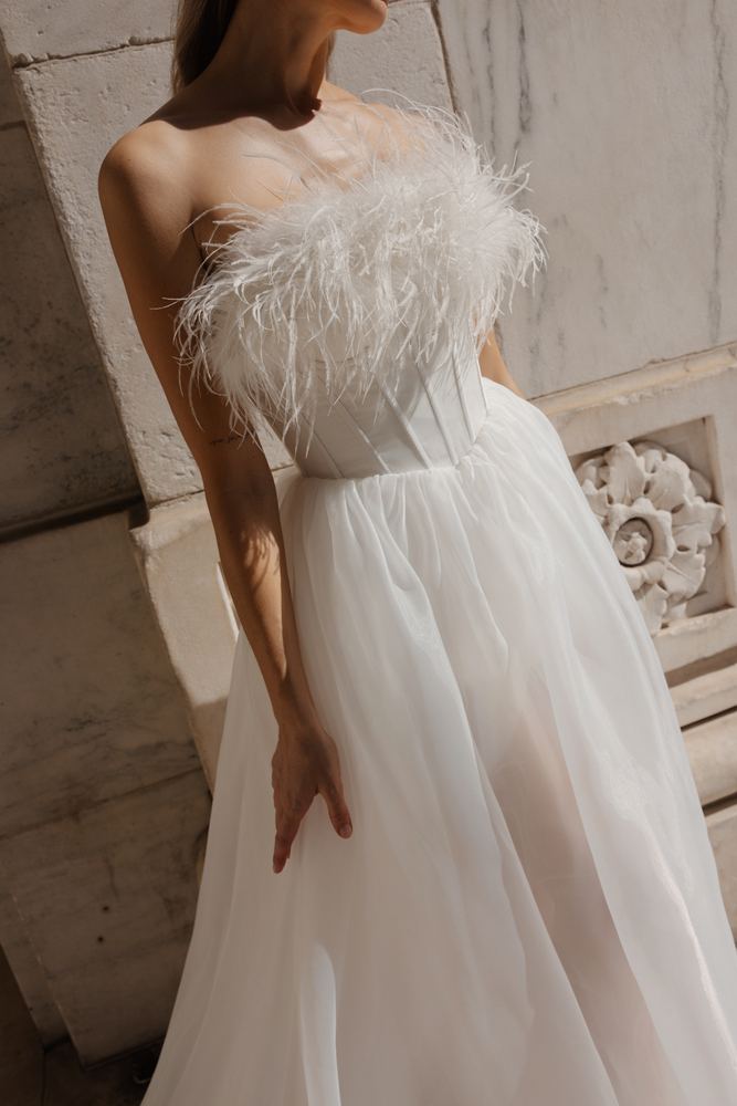 Feathered bodice detail of a Sienricher gown